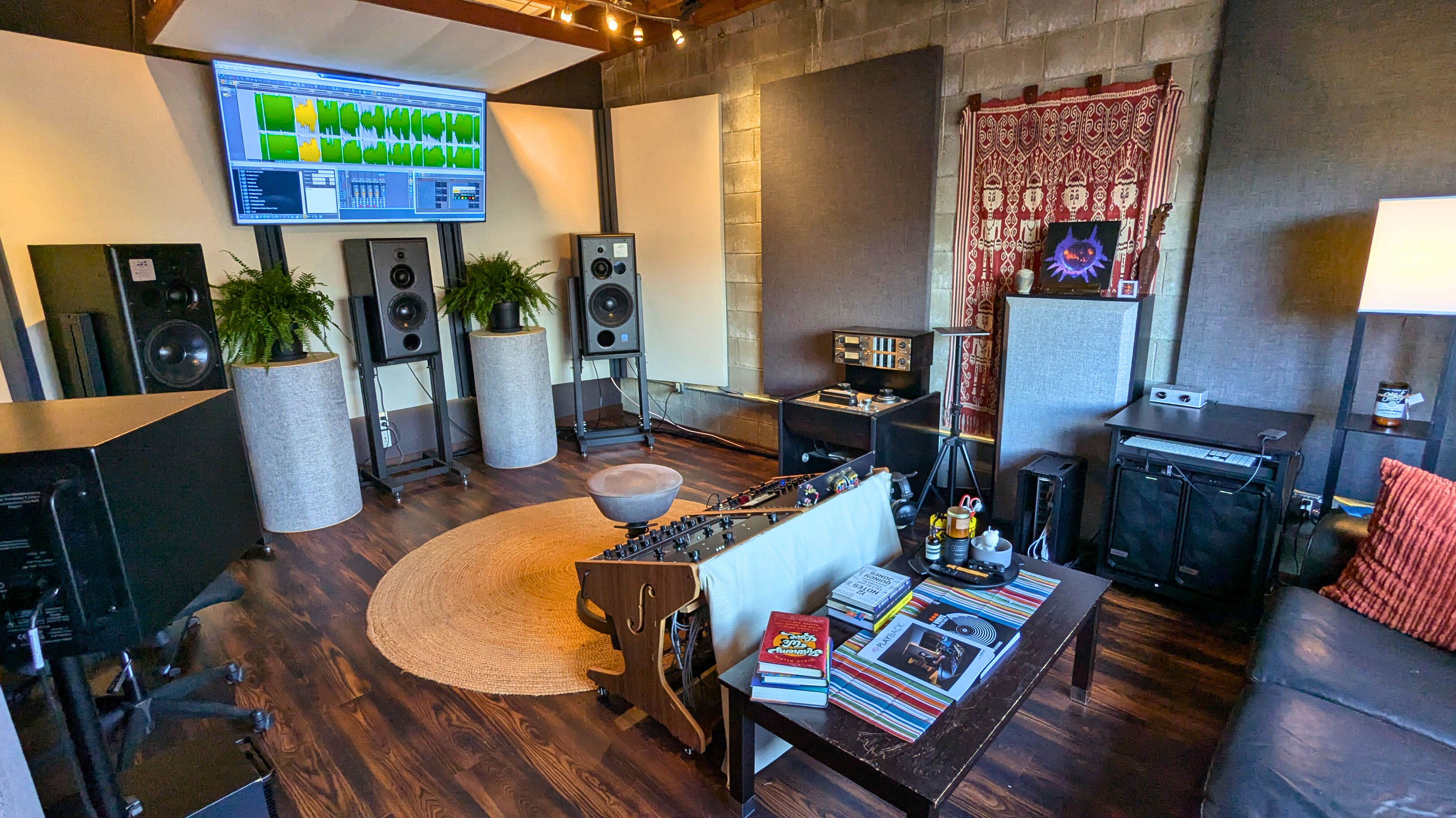 Studio lounge area with plants and listening couch